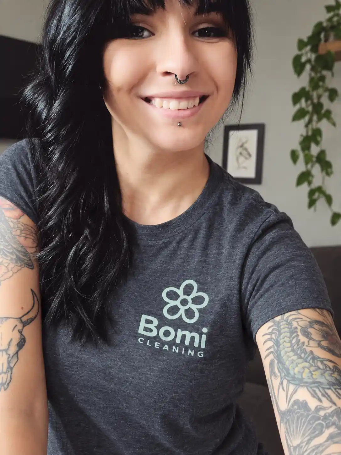 Danielle McLeod, founder of Bomi Cleaning, smiling in a Bomi Cleaning T-shirt