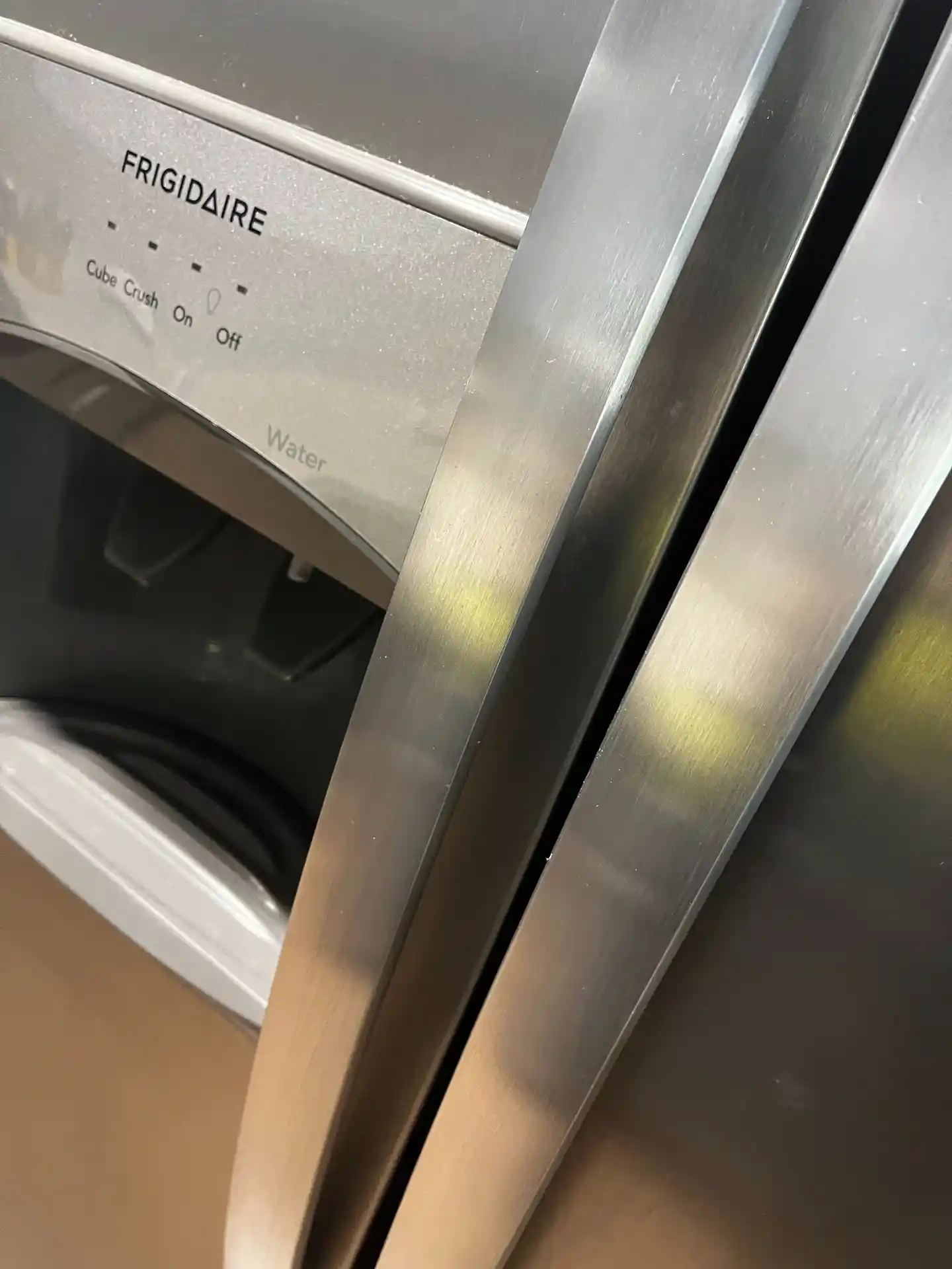 The same stainless steel refrigerator doors polished clean, after cleaning