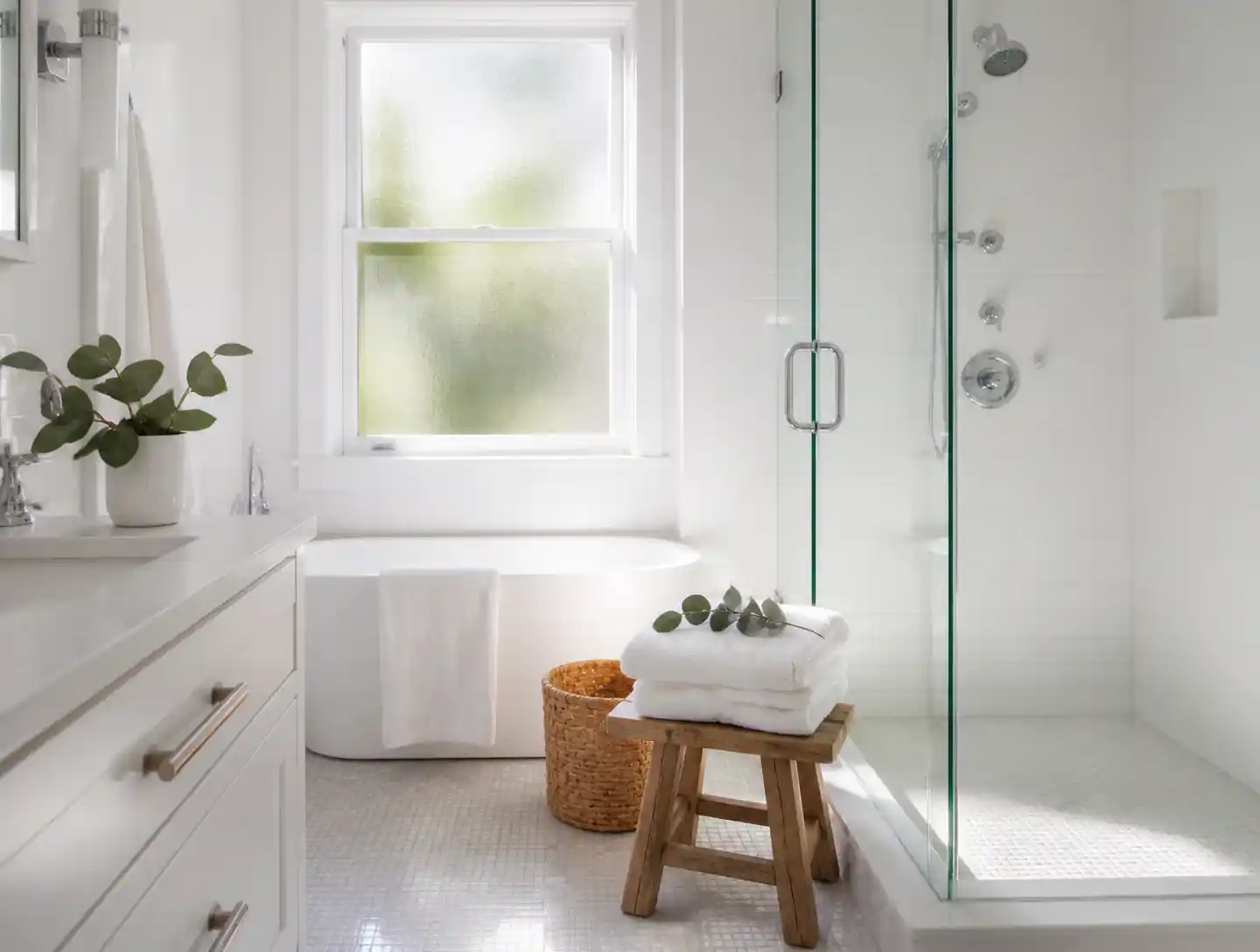 A spotless white bathroom with gleaming chrome after a move-out clean